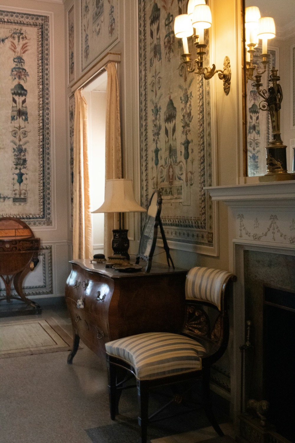 Georgian sitting room with a fireplace and tall sash window